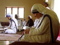 Mother Teresa praying Buddhist style