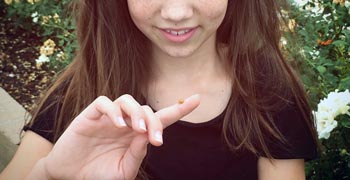 a ladybug land on a girls finger