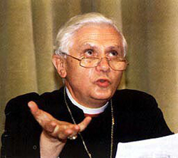 A photograph of Ratzinger holding a paper