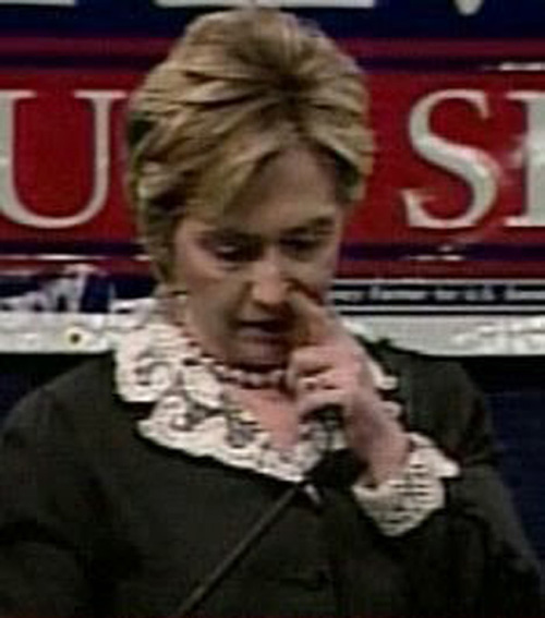 Hillary picking her nose