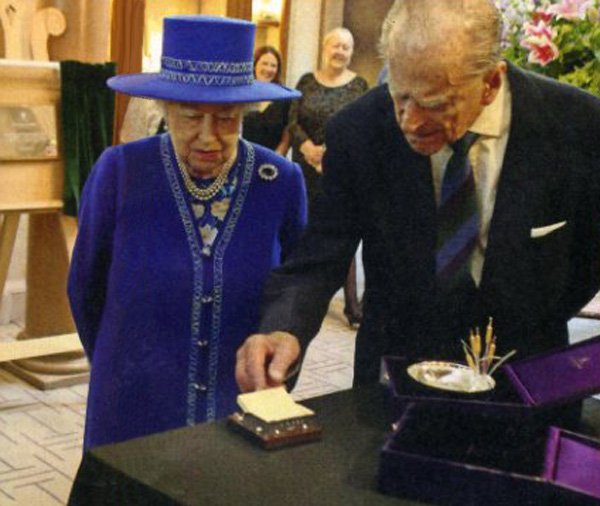 Queen receiving a gift