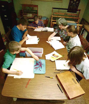 Homeschool students gathered around a table