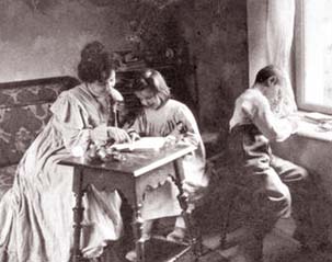 A black and white photograph of a mother working in the home with her children