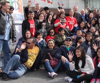 A group of goofy grinning Catholics wearing jeans and t-shirts and the Knock Eucharistic congress in 2015