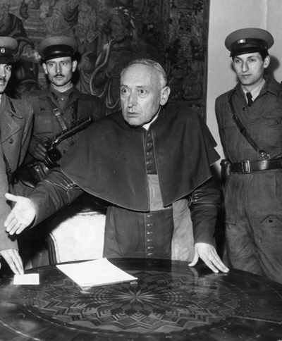 Card. Mindszenty with several guards after being freed from Communist prison