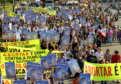 Anti-abortion protestors marching with signs