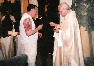 Fr. Tony Vercellones gives communion to a homosexual
