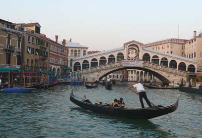 A gondola travels the canals of Venice