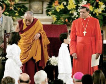 The Dalai Lama greets children alongside the Cardinal