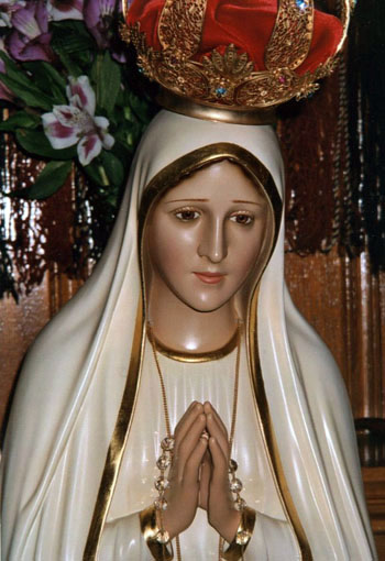 Our Lady of Fatima wears a sad expression