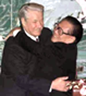 Boris Yeltin embraces Chinese president Jiang Zemin in Beijing