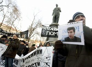 Demonstrators hold a portrain of slain lawyer Markelov