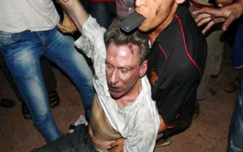 The body of ambassador Stevens being dragged away by Muslims