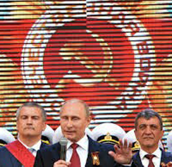 Putin and other russians against the backdrop of the Communist hammer and sickle