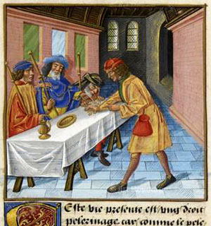 Medieval pilgrims paying at a hostel