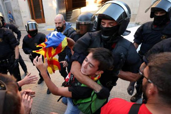 Police violently arresting a young protester in Catalonia