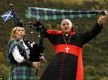 Cardinal O'brien dancing to bagpipes