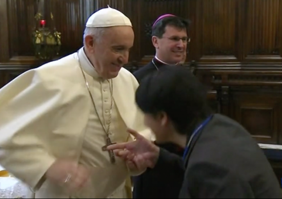 Kissing Pope's hand