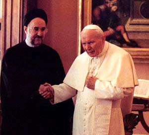 John Paul II shakes hands with the Iranian president
