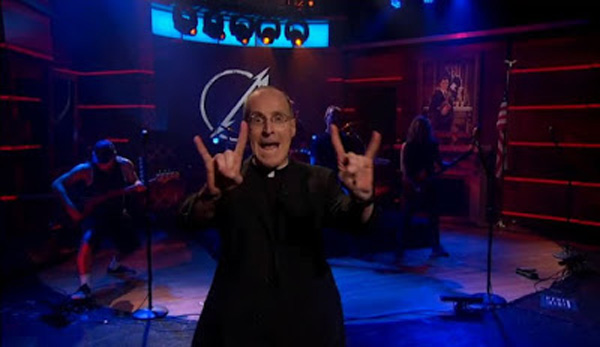 Fr James Martin making satanic symbols with a heavy metal band