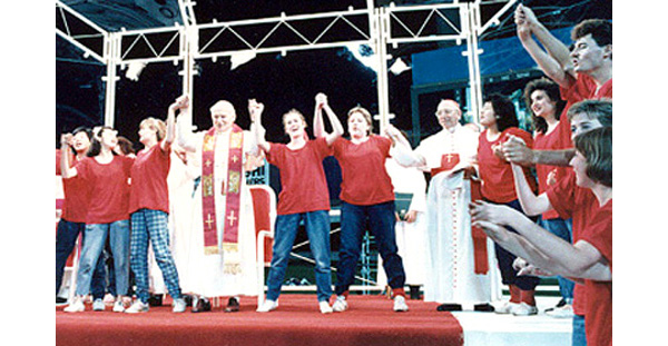 John Paul II dancing on stage with many youths