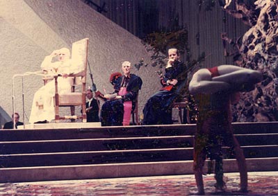 Pope John Paul II and a few prelates watch a highly indecent acrobatic performance