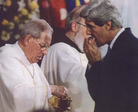 Kerry receives Communion in the hand