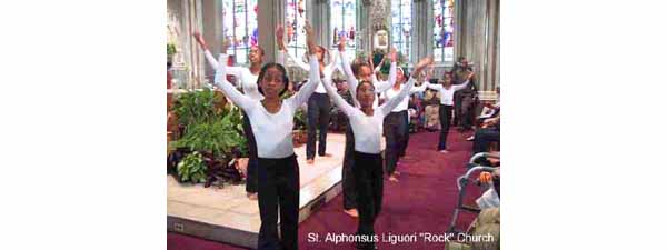 Women dancing inside the Rock Church