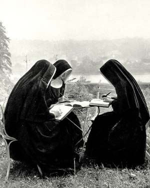 pre-conciliar nuns in traditional habits engaged in somber and dignified recreation