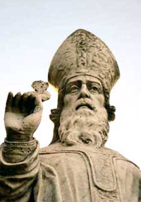 A statue of St Patrick holding a shamrock