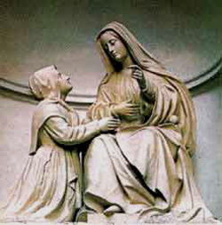 A statue of St. Catherine receiving her mission from Our Lady