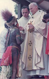 Saint Wojtyla gives communion to semi nude natives