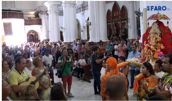 a Catholic choir signing 'Sancta Maria' in honor to honor Ganesh