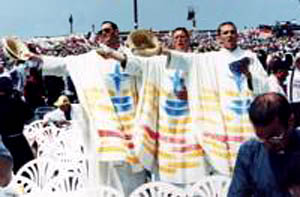 Rainbow vested priests singing at World Youth Day