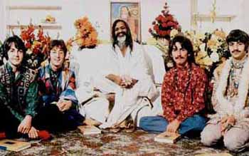 The Beatles sitting and dressed Hindu style with guru Maharishi
