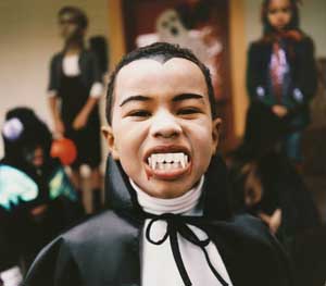 A child dressed as a vampire